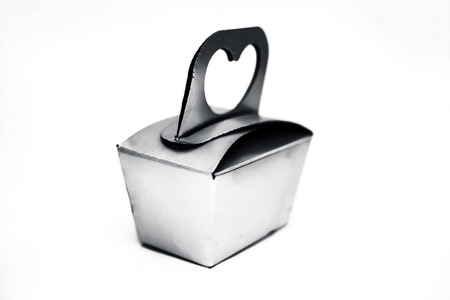 Close up of silver colored gift box isolated on white.