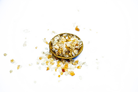 Close up of popular Indian &Asian spices isolated on white in a glass plate i.e.  Khatira gond or quatira gond or Indian edible gum or common edible gum or goundh or gound or acacia gum.の写真素材