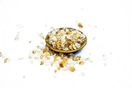 Close up of popular Indian &Asian spices isolated on white in a glass plate i.e.  Khatira gond or quatira gond or Indian edible gum or common edible gum or goundh or gound or acacia gum.の写真素材