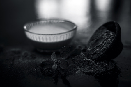 Ayurvedic herb brahmi or Waterhyssop with its beneficial paste ina  glass bowl along with its powder on wooden surface.の写真素材