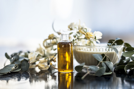 Herbal and floral essence or concentration of drumstick flowers along with its paste on wooden surface.の写真素材