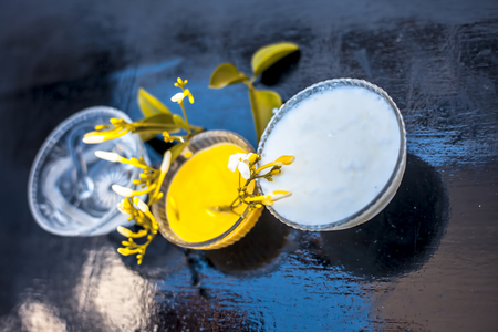 Ayurevidic face pack of Indian jasmine in a glass bowl on wooden surface i.e. jasmine Petals well mixed with milk cream & water. Used for skin whitening purposes.の写真素材