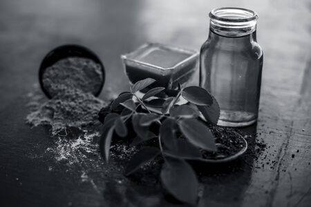 Face pack of devil's dung powder on wooden surface i.e. Hing powder well mixed with sandal wood...