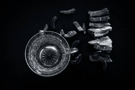 Hot herbal ayurvedic aloe vera tea on wooden surface in  transparent glass cup with entire ingredients with it.Used to build immnue system, To Lower cholesterol levels and many more.の写真素材