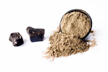 Raw hing or asofoetida or devil's dung isolated on white with its power also.の写真素材