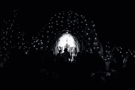 Church decorated with colorful lights during Christmas and a Christmas tree.の写真素材