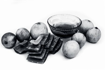 Best method to remove tan at home isolated on white i.e. Aloe vera gel well mixed with some lemon juice in it.Entire raw ingredients present on the surface.の写真素材