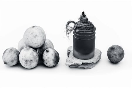 Lemon face mask isolated on white i.e. Lemon juice well mixed with fuller's earth along with the help of some rose water.Entire raw ingredients present on the surface.の写真素材