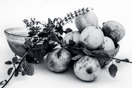 Lemon face pack isolated on white i.e. lime juice well mixed with tulsi or holy basil's juice.Used for the treatment or to remove dirt,dust and other impurities.の写真素材