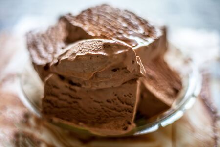 Close up of glass dish full of Chocolate chip ice cream.