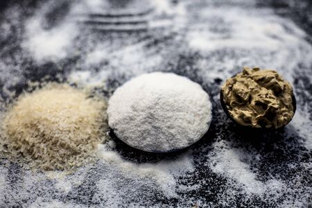 Remedy for smooth hair on wooden surface consisting of rice flour and rice grains well mixed with mulpani mitti or multani mitti.の写真素材