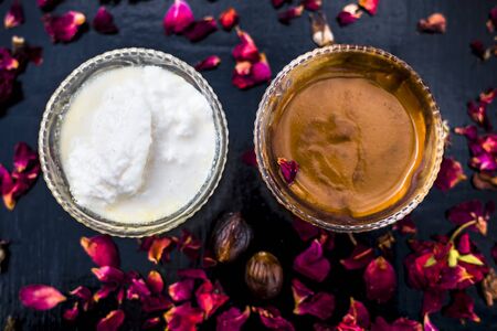 Nutmeg face mask to treat to even out discolorations and pigmentation on your face on the wooden surface consisting of Nutmeg powder, lemon juice, and curd.の写真素材