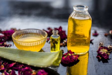 The trio pack of herbs and ingredients to fight dandruff on the wooden surface well mixed in a glass bowl which are castor oil, tea tree oil, and some aloe vera gel. Also used to treat itchiness.;の写真素材