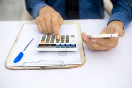 Finance person table's or workplace's close up a shot while he was doing some finance and...