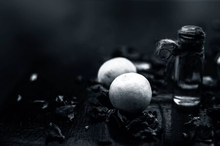 Best cheap DIY face mask for acne scars of multani mitti or fuller's earth or mulpani mitti on the wooden surface consisting of lemon juice, fuller's earth, and some rose water also.の写真素材