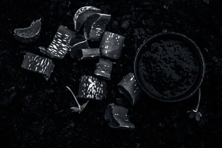 Aloe vera gel hair mask in a glass bowl consisting of activated charcoal & some aloe vera gel. To...