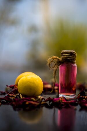 Best cheap DIY face mask for acne scars of multani mitti or fuller's earth or mulpani mitti on the wooden surface consisting of lemon juice, fuller's earth, and some rose water also.の写真素材