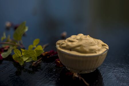 Homemade DIY face mask on the wooden surface consisting of yogurt,multani mitti or mulpani mitti...