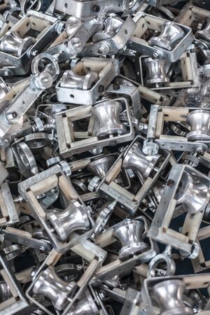 Bunch of hanger pulleys or handling blocks used with/for high tension electric wires.の写真素材