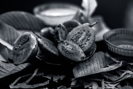 Skin whitening remedy/treatment on the black shiny surface consisting of guava pulp and honey. Also used in the spa as a face mask.の写真素材