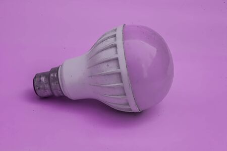White and Pink colored bulb isolated on pink background. Concept of Pink in pink color.