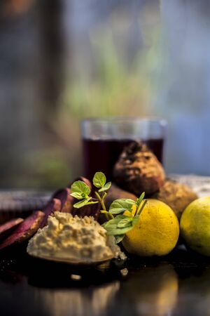 Face mask for a natural glow for all skin types on the black wooden surface consisting of some...