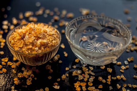 Gond katara/Gond Katira/ Tragacanth Gum or edible gum in a glass bowl along with some water in...