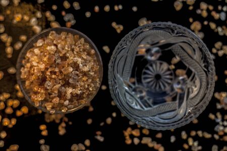 Gond katara/Gond Katira/ Tragacanth Gum or edible gum in a glass bowl along with some water in...