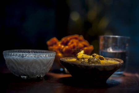 Jaggery face mask to get a lustrous look on a brown surface consisting of jaggery or gud, Multani mitti, and curd.の写真素材