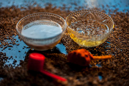 Face mask for nourishing your skin consisting of betel leaves, besan or chickpea powder, Multani mitti, or mulpani mitti on a black surface.の写真素材