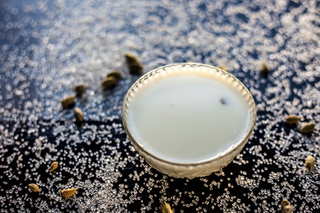 Kesar milk or saffron milk in a glass bowl along with saffron spread on the surface.の写真素材
