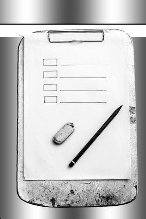 Top shot of a paper and pen with some checkmark list drawn on the paper indicating today's do list isolated on white.の写真素材