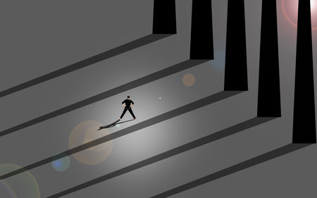 Silhouette of a man walking on the stairs going up.の写真素材