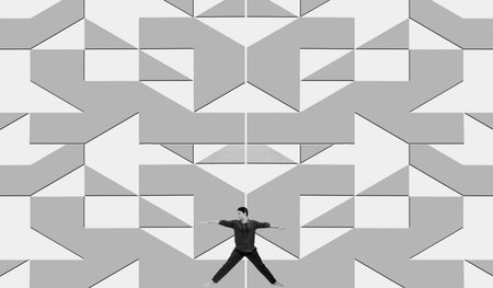 Full-length shot of a smiling man doing some static stretching exercises on a decorative floral design floor isolated on white.の写真素材