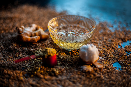 Shot of cumin seeds, sea salt, ginger powder,fennel seeds on brown surface for curing bloating.