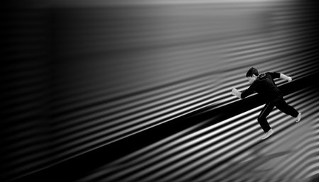 Shot of a single man on the edge with some birds in black and white image. Man in his imaginary world. Conceptual Image. Modern Loneliness.の写真素材