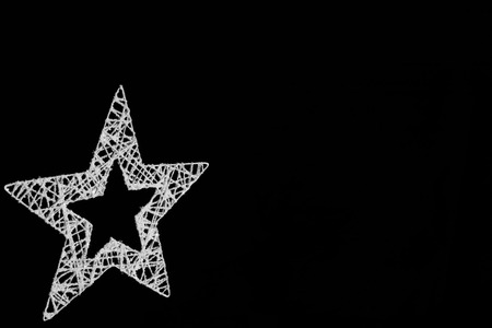 Silver star made from vires isolated on black backgroundの写真素材