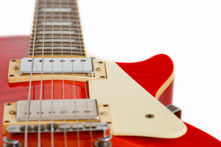 Close up of cherry sunburst guitar isolated on white backgroundの写真素材