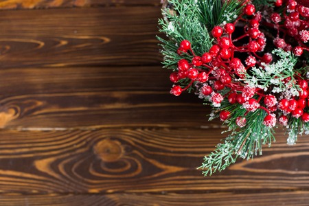 Christmas decorations on a wooden background, top view, space for your text.の写真素材