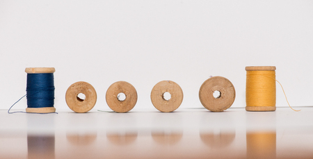 Bobbins of thread isolated on white backgroundの写真素材