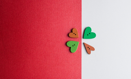 Beautiful paper hearts on white paper background, close-upの写真素材