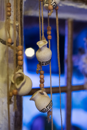 Decorative pitchers on a string in a rural hutの写真素材