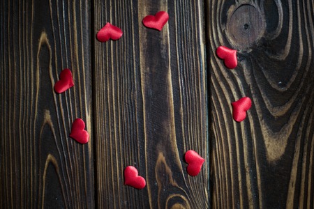 Valentines day red heart on dark wood. Holidays background. Postcard for love.の写真素材