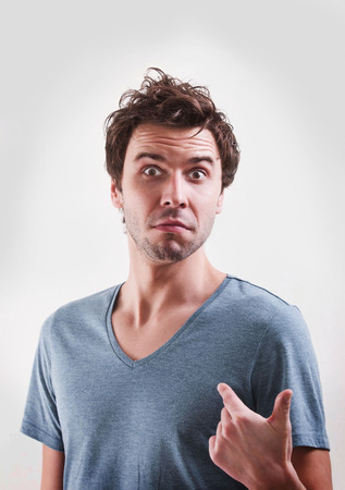 portrait of a surprised man in studioの写真素材