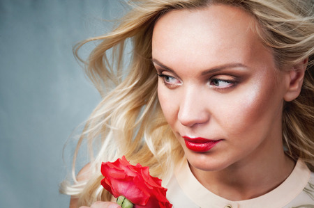 sensual tender delicate young woman portrait with breeze hair and red lips, enjoyment concept on vintage backgroundの写真素材