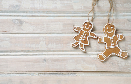 sweet homemade cookies for Christmas on white old wooden background, holiday concept