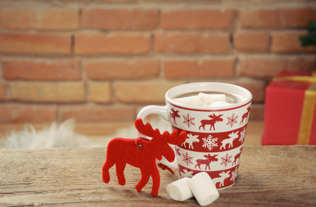 hot cocoa drink with sweet marshmallow on brick background, holiday conceptの写真素材