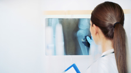 chemical laboratory scene: attractive young student scientist observing liquid measures medicine...