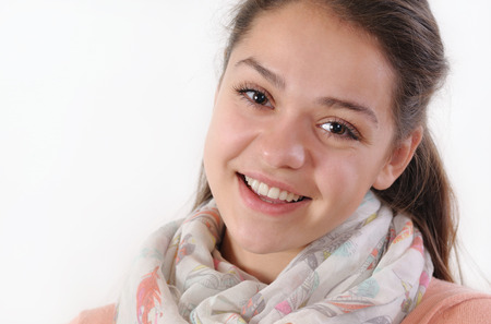 close up emotional portrait of cute beautiful young girl on white background, lifestyle conceptの写真素材