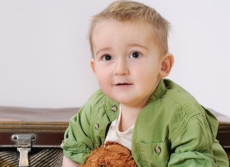 portrait of little cute smiling child boy with his toy, happy childhood concept, happy childの写真素材